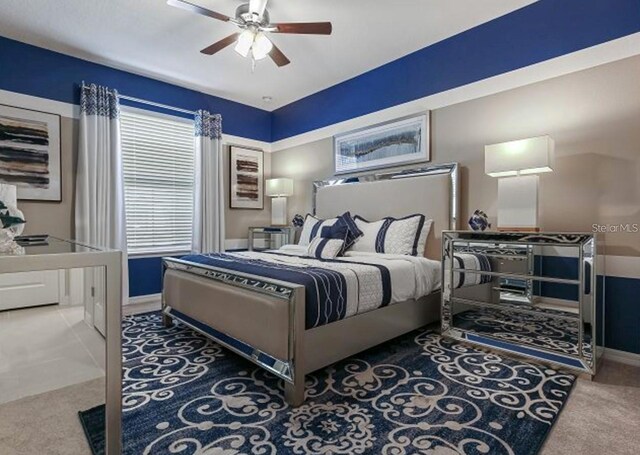 8892 Bengal Ct, Kissimmee, FL 34747 - carpeted bedroom with baseboards and ceiling fan