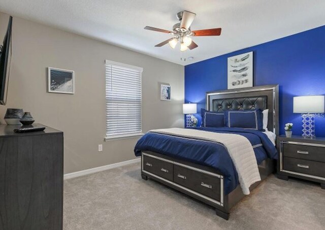 8892 Bengal Ct, Kissimmee, FL 34747 - bedroom with carpet, a ceiling fan, and baseboards