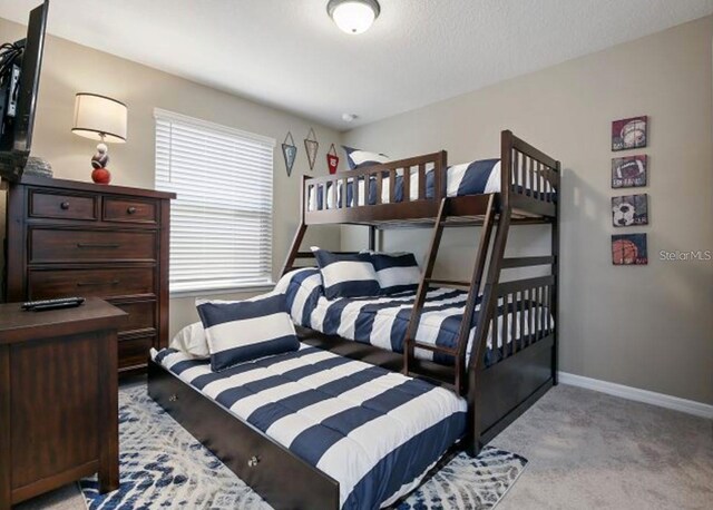 8892 Bengal Ct, Kissimmee, FL 34747 - bedroom featuring light carpet and baseboards