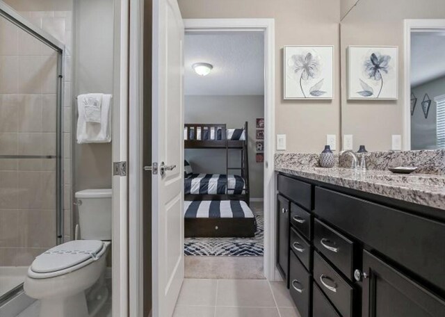 8892 Bengal Ct, Kissimmee, FL 34747 - bathroom featuring vanity, toilet, ensuite bath, and a shower stall