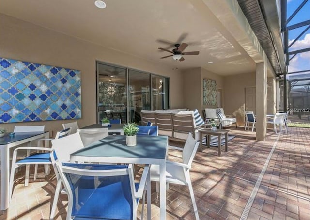 8892 Bengal Ct, Kissimmee, FL 34747 - view of patio / terrace featuring outdoor dining space, glass enclosure, outdoor lounge area, and ceiling fan