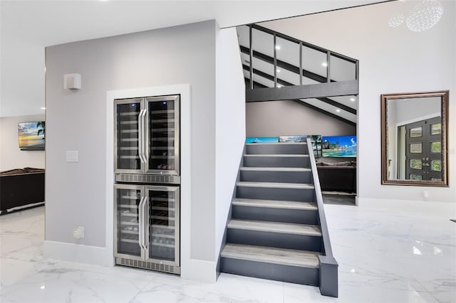 835 Dyson Dr, Winter Springs, FL 32708 - staircase with wine cooler, marble finish flooring, and recessed lighting