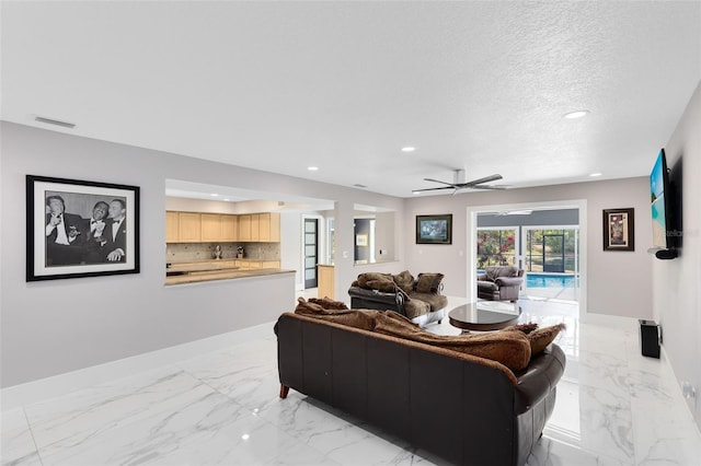 835 Dyson Dr, Winter Springs, FL 32708 - living room with light marble finish floors, recessed lighting, a textured ceiling, and ceiling fan