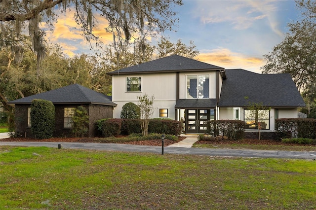 835 Dyson Dr, Winter Springs, FL 32708 - view of front of property featuring a front lawn, roof with shingles, driveway, and french doors