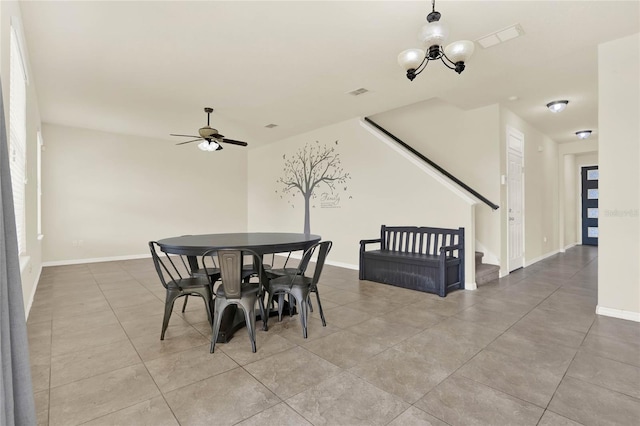 2200 Rapollo Dr, Kissimmee, FL 34741 - dining space with stairs, visible vents, baseboards, and a ceiling fan