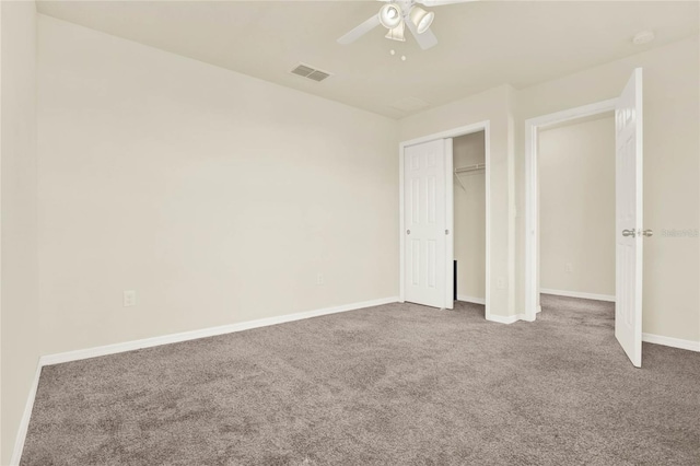2200 Rapollo Dr, Kissimmee, FL 34741 - unfurnished bedroom with a closet, carpet flooring, a ceiling fan, baseboards, and visible vents