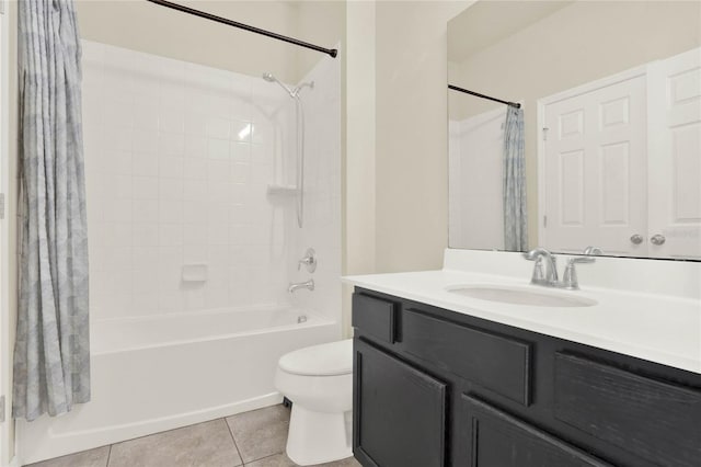 2200 Rapollo Dr, Kissimmee, FL 34741 - bathroom featuring tile patterned flooring, shower / bath combo with shower curtain, toilet, and vanity