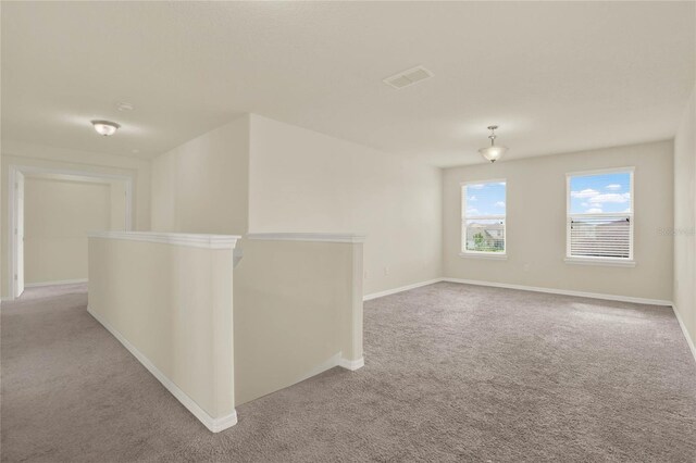 2200 Rapollo Dr, Kissimmee, FL 34741 - empty room featuring carpet floors, baseboards, and visible vents