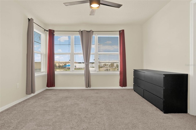 2200 Rapollo Dr, Kissimmee, FL 34741 - spare room featuring baseboards, carpet, and a ceiling fan