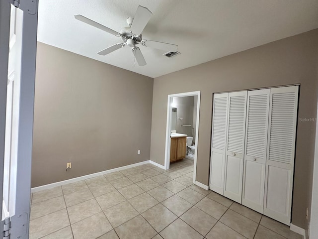 9021 Lee Vista Blvd Unit 1707, Orlando, FL 32829 - unfurnished bedroom with baseboards, visible vents, a closet, and light tile patterned floors