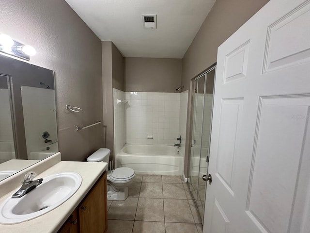 9021 Lee Vista Blvd Unit 1707, Orlando, FL 32829 - full bathroom featuring tile patterned floors, toilet, vanity, washtub / shower combination, and visible vents