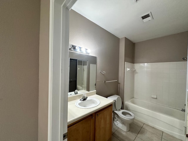 9021 Lee Vista Blvd Unit 1707, Orlando, FL 32829 - bathroom featuring tile patterned flooring, vanity, shower / bathing tub combination, toilet, and visible vents