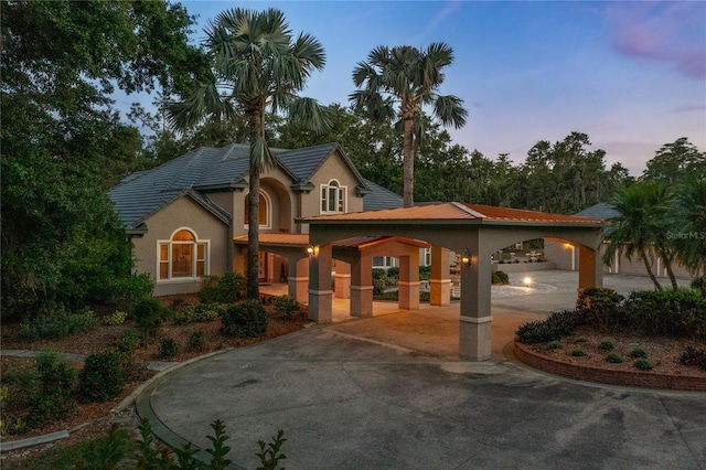 11450 Nellie Oaks Bnd, Clermont, FL 34711 - view of front of property featuring stucco siding and concrete driveway