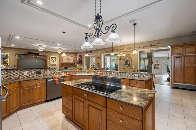 11450 Nellie Oaks Bnd, Clermont, FL 34711 - kitchen featuring dishwasher, black electric stovetop, a large island, brown cabinets, and recessed lighting