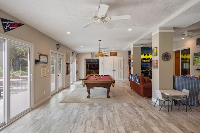 11450 Nellie Oaks Bnd, Clermont, FL 34711 - game room with a ceiling fan, light wood-style flooring, a textured ceiling, pool table, and french doors