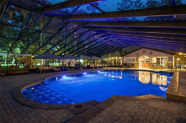 11450 Nellie Oaks Bnd, Clermont, FL 34711 - swimming pool with a patio area, an outdoor living space, and glass enclosure