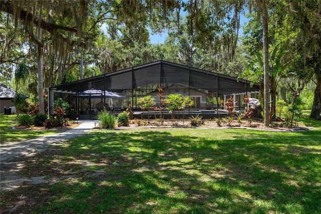 11450 Nellie Oaks Bnd, Clermont, FL 34711 - back of house with a lawn