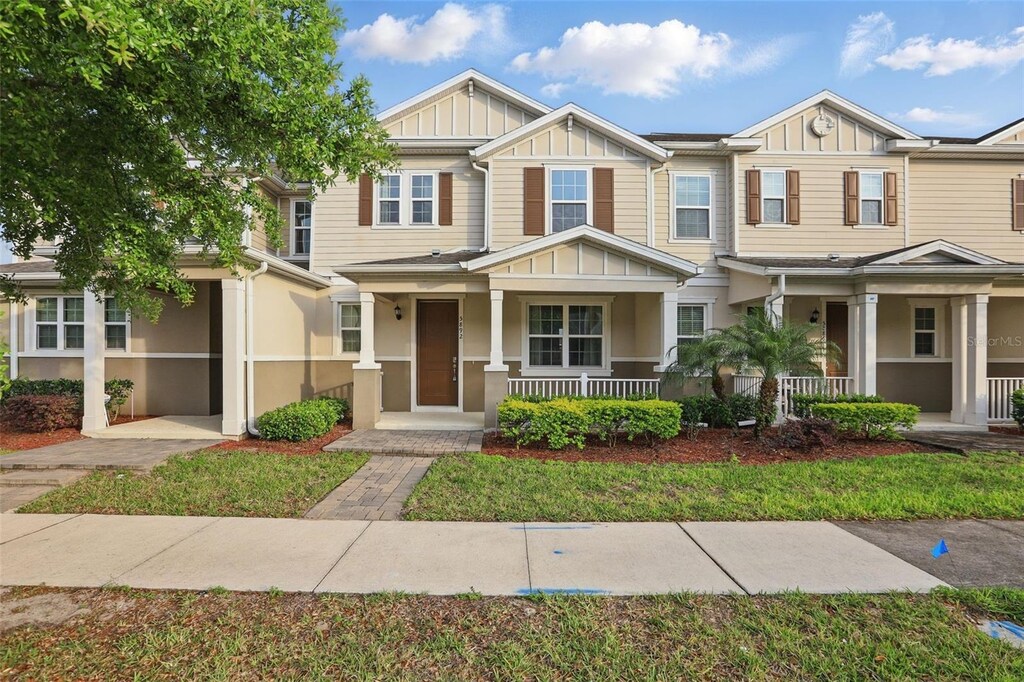 5892 Soter Ln, Windermere, FL 34786 - view of property featuring covered porch and board and batten siding