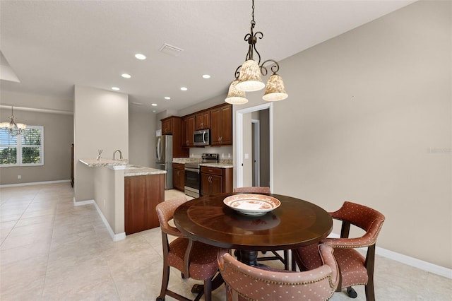dining room with recessed lighting, visible vents, an inviting chandelier, and baseboards
