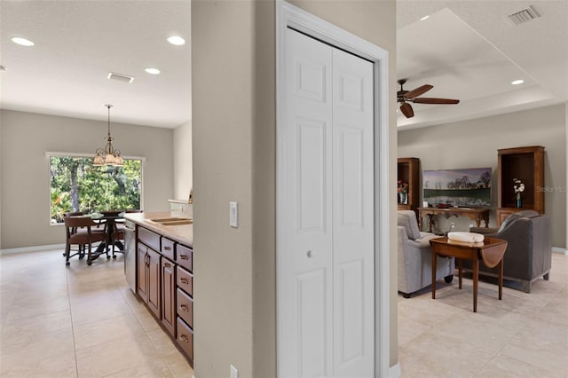 hall featuring light tile patterned flooring, visible vents, recessed lighting, and baseboards