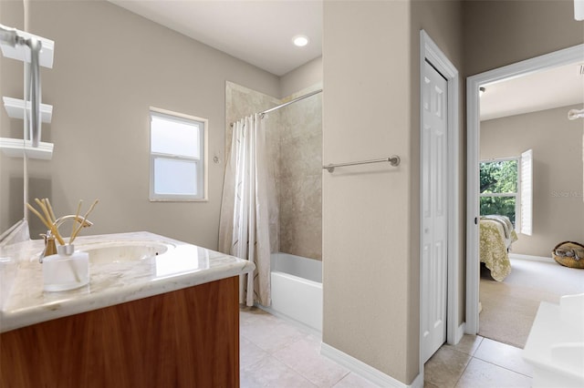 full bath featuring vanity, shower / bath combination with curtain, tile patterned flooring, and baseboards