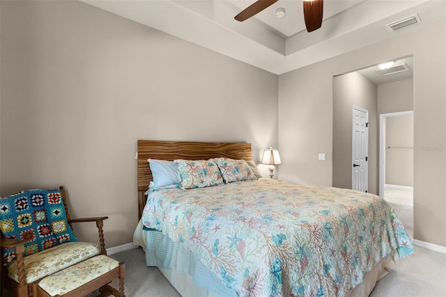 carpeted bedroom with visible vents, ceiling fan, and baseboards