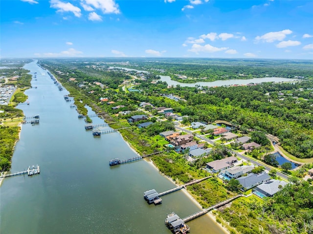 birds eye view of property featuring a water view and a residential view