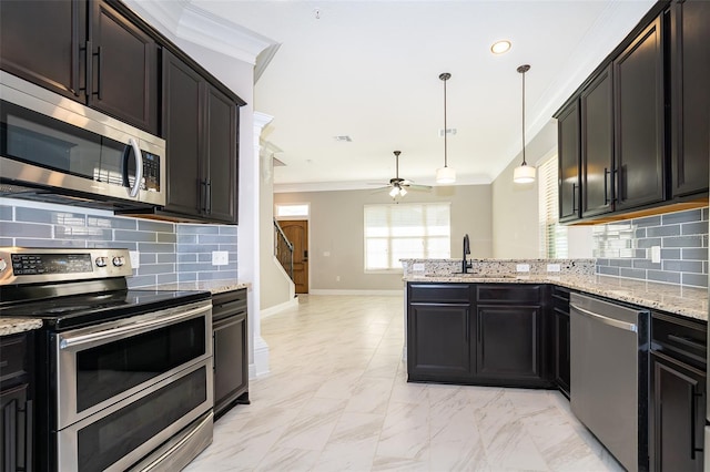 9330 Meadow Hunt Way, Winter Garden, FL 34787 - kitchen featuring stainless steel appliances, a ceiling fan, a peninsula, ornamental molding, and tasteful backsplash
