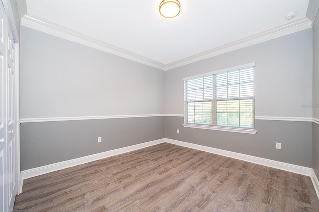 9330 Meadow Hunt Way, Winter Garden, FL 34787 - empty room featuring wood finished floors, ornamental molding, and a smoke detector