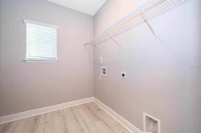 9330 Meadow Hunt Way, Winter Garden, FL 34787 - laundry area featuring electric dryer hookup, washer hookup, and light wood-style floors