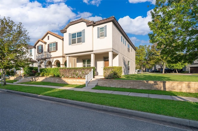 9330 Meadow Hunt Way, Winter Garden, FL 34787 - mediterranean / spanish house featuring a front lawn, stucco siding, and a tiled roof