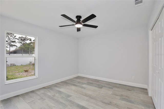 542 Terrace Cove Way, Orlando, FL 32828 - unfurnished bedroom with visible vents, a ceiling fan, a closet, baseboards, and light wood-style flooring