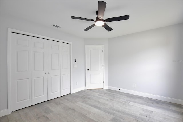 542 Terrace Cove Way, Orlando, FL 32828 - unfurnished bedroom with baseboards, light wood-style floors, visible vents, and a closet