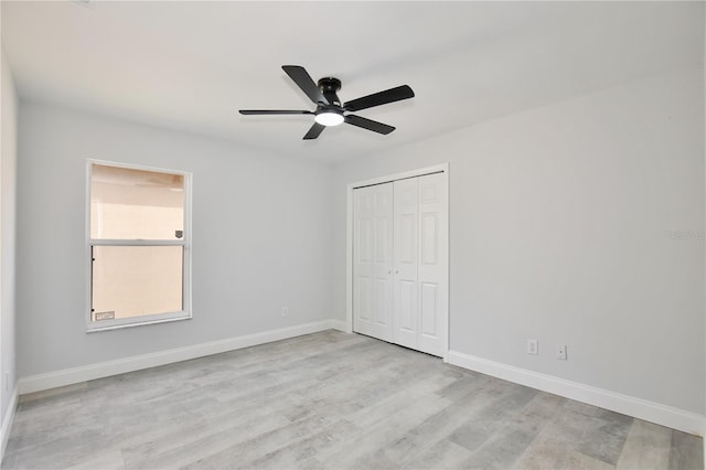 542 Terrace Cove Way, Orlando, FL 32828 - unfurnished bedroom with a closet, light wood finished floors, baseboards, and a ceiling fan