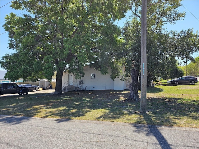 509 S Hudson St, Orlando, FL 32835 - view of home's exterior featuring a yard