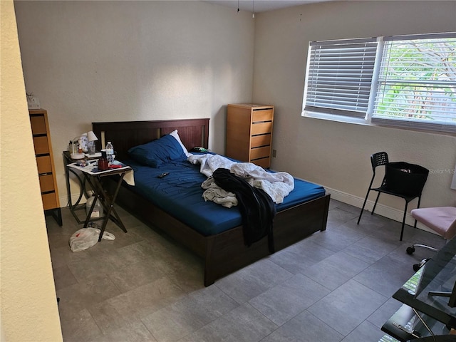 509 S Hudson St, Orlando, FL 32835 - bedroom featuring baseboards