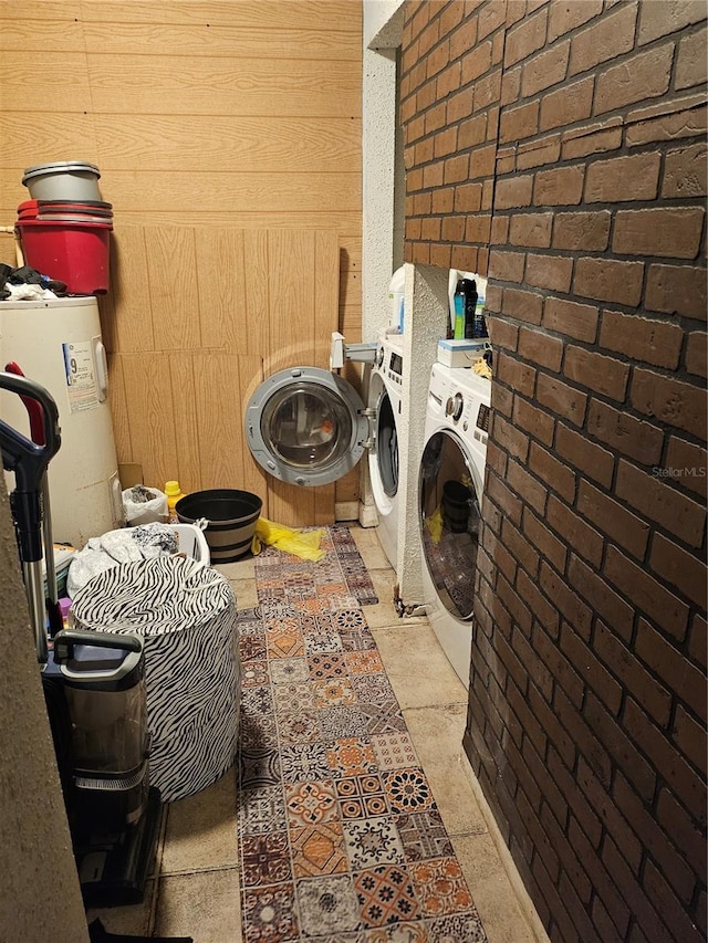509 S Hudson St, Orlando, FL 32835 - washroom featuring water heater, wooden walls, washing machine and clothes dryer, and laundry area