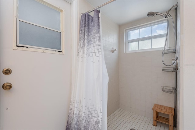 full bath with a shower stall