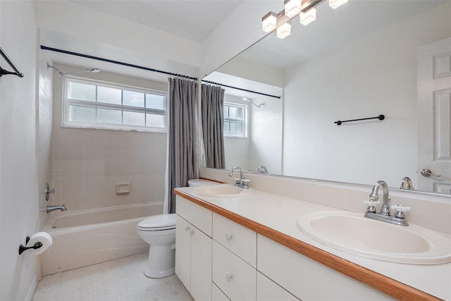 bathroom with shower / tub combo with curtain, a sink, toilet, and double vanity