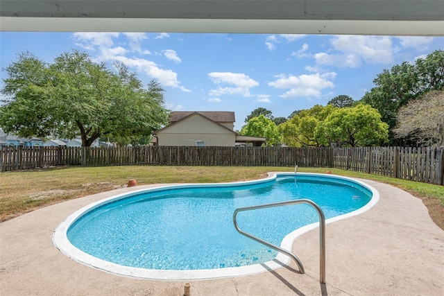 view of swimming pool with a fenced backyard, a fenced in pool, and a lawn