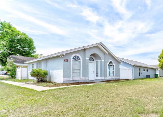 294 San Gabriel St, Winter Springs, FL 32708 - ranch-style home featuring a front yard, fence, stucco siding, and central air condition unit