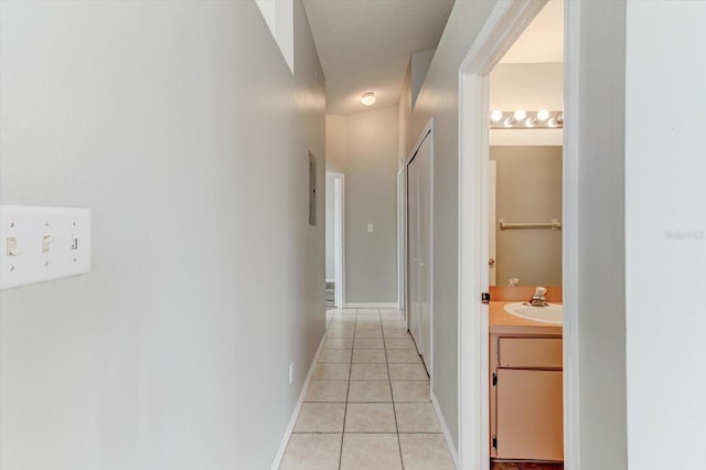 294 San Gabriel St, Winter Springs, FL 32708 - hall featuring baseboards, a sink, and light tile patterned floors