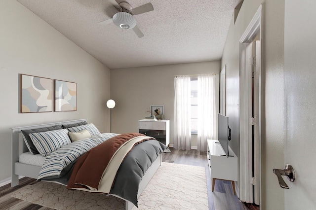294 San Gabriel St, Winter Springs, FL 32708 - bedroom featuring a textured ceiling, wood finished floors, ceiling fan, and vaulted ceiling