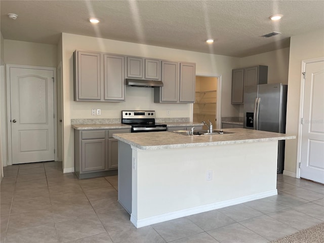 3009 Tansy St, Tavares, FL 32778 - kitchen with an island with sink, gray cabinets, light countertops, stainless steel appliances, and visible vents
