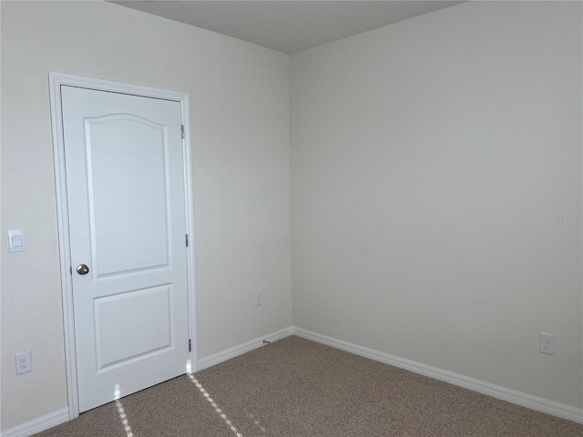 3009 Tansy St, Tavares, FL 32778 - unfurnished room with carpet flooring and baseboards