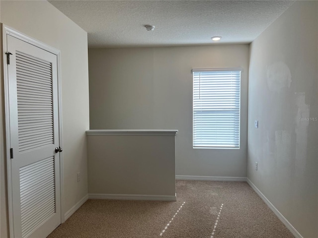 3009 Tansy St, Tavares, FL 32778 - unfurnished bedroom featuring carpet, baseboards, and a textured ceiling