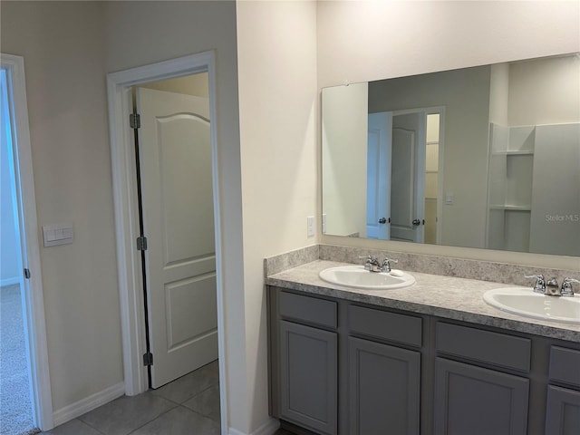 3009 Tansy St, Tavares, FL 32778 - full bath featuring tile patterned floors, double vanity, a sink, and baseboards