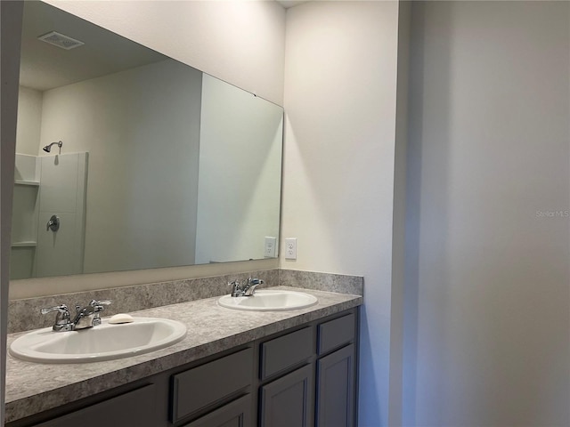 3009 Tansy St, Tavares, FL 32778 - full bath with visible vents, a sink, a shower, and double vanity