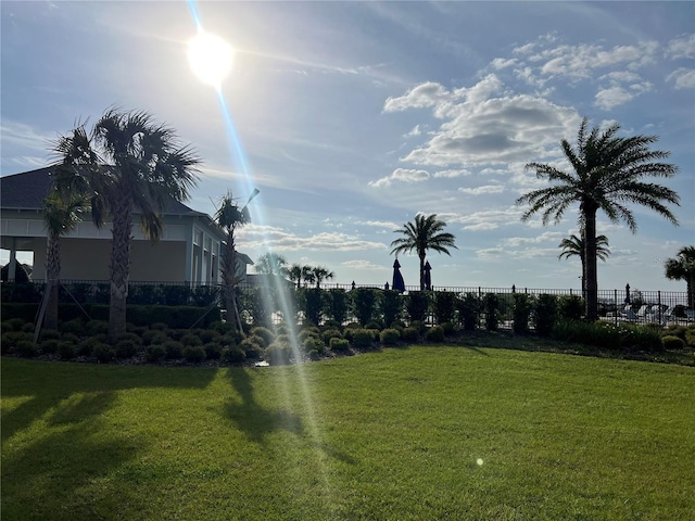 3009 Tansy St, Tavares, FL 32778 - view of home's community with fence and a lawn