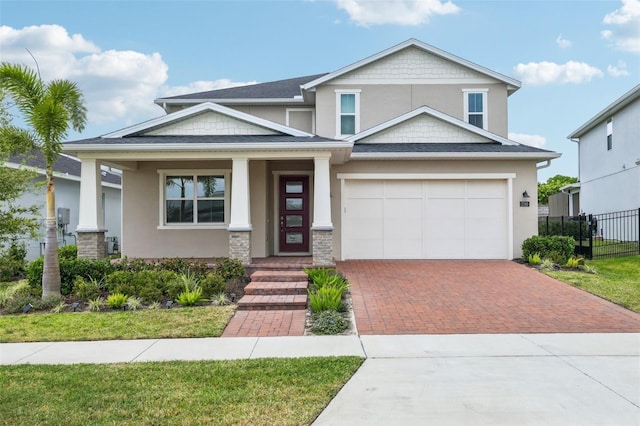 2785 Park Ridge St, Apopka, FL 32712 - craftsman house with decorative driveway, a porch, stucco siding, and a garage
